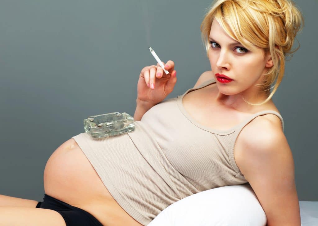 Woman smoking while pregnant